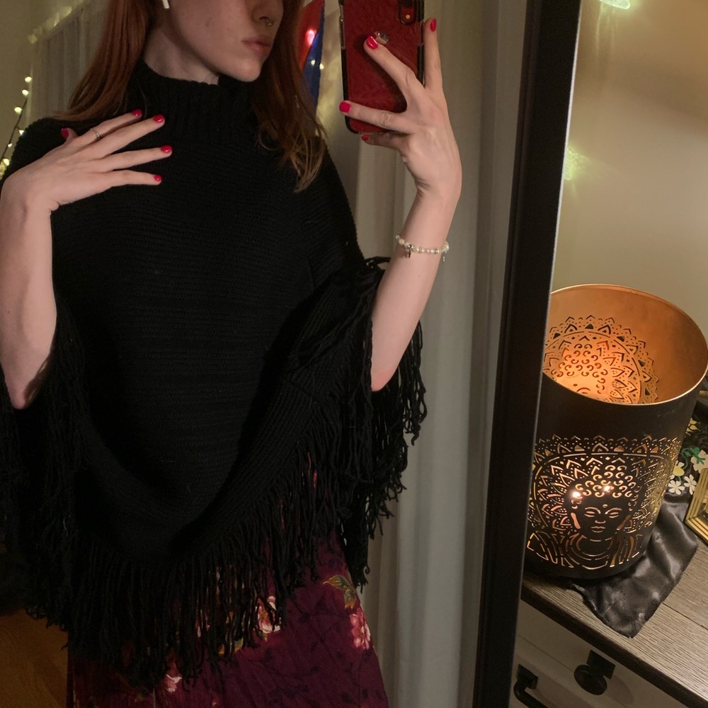 Black turtleneck poncho.